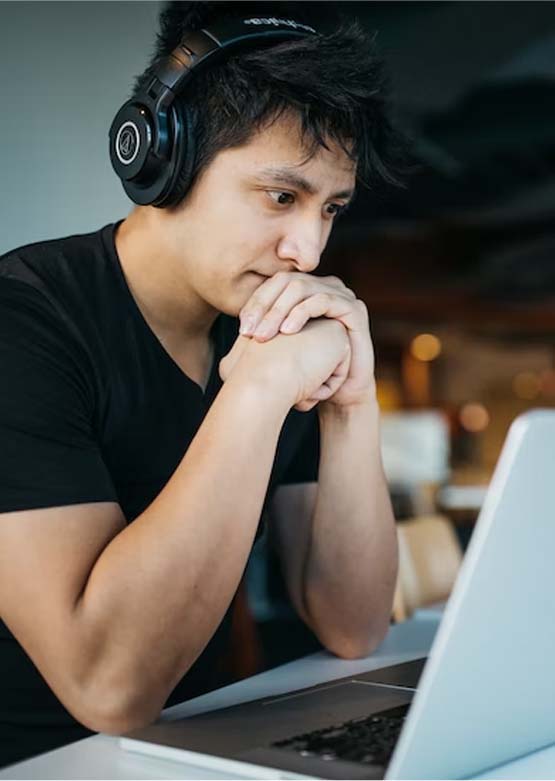 man sitting at computer